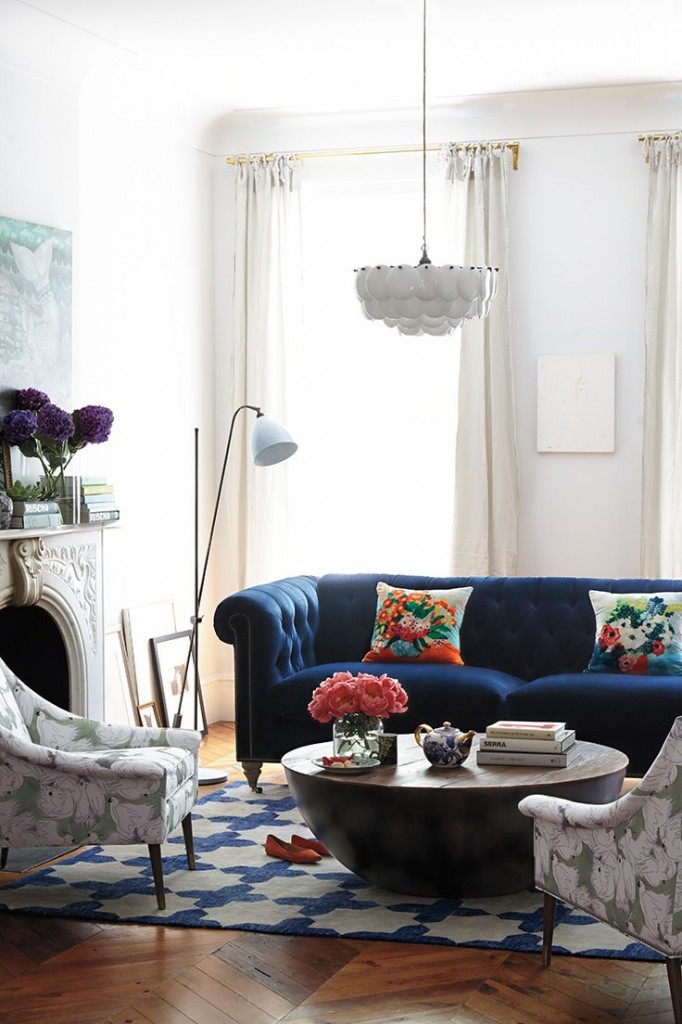 Blue velvet Chesterfield sofa in a designer living room