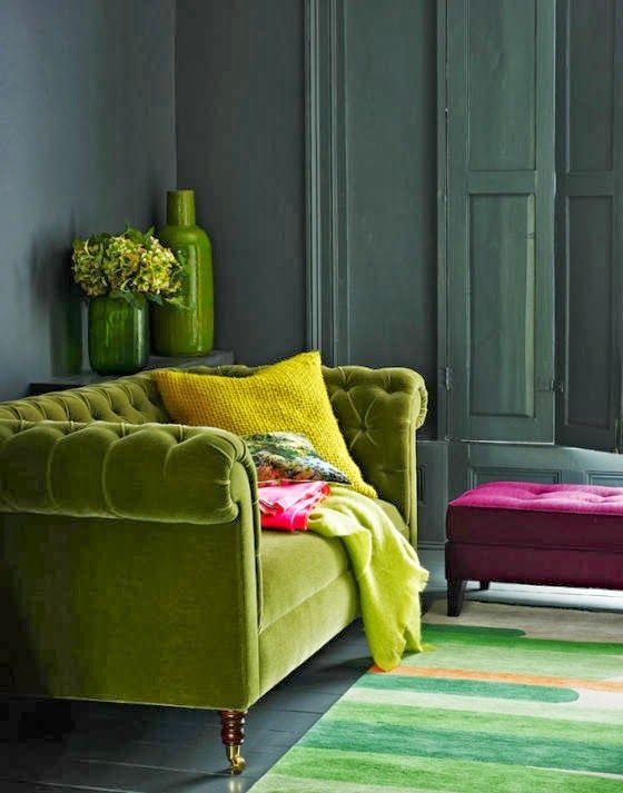 Lime green Chesterfield sofa in a designer living room with accents of hot pink